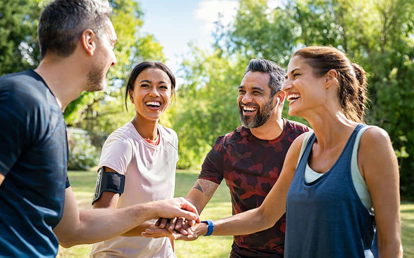 a group of people holding hands together