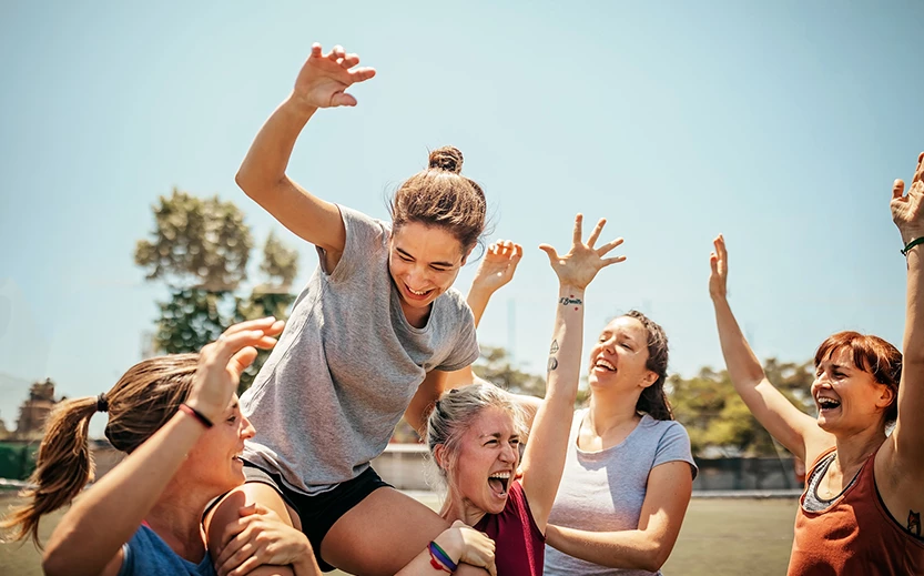 a group of women cheering