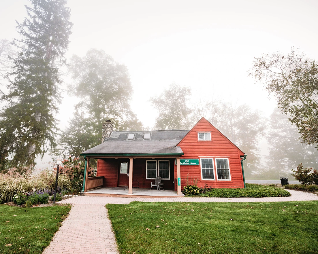 a house with a lawn and trees