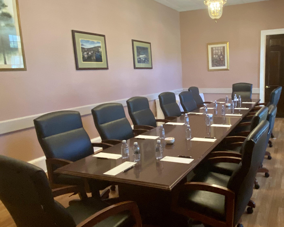 a conference room with chairs and a table