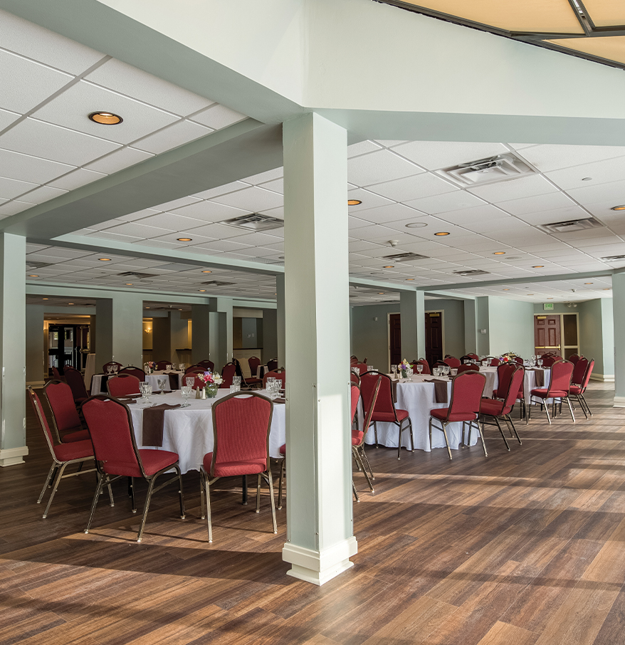 a room with tables and chairs