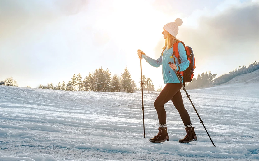a woman walking in the snow