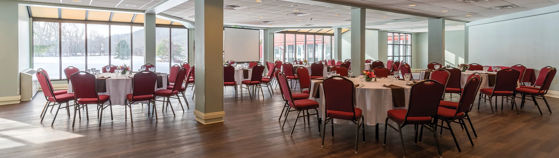 a room with tables and chairs