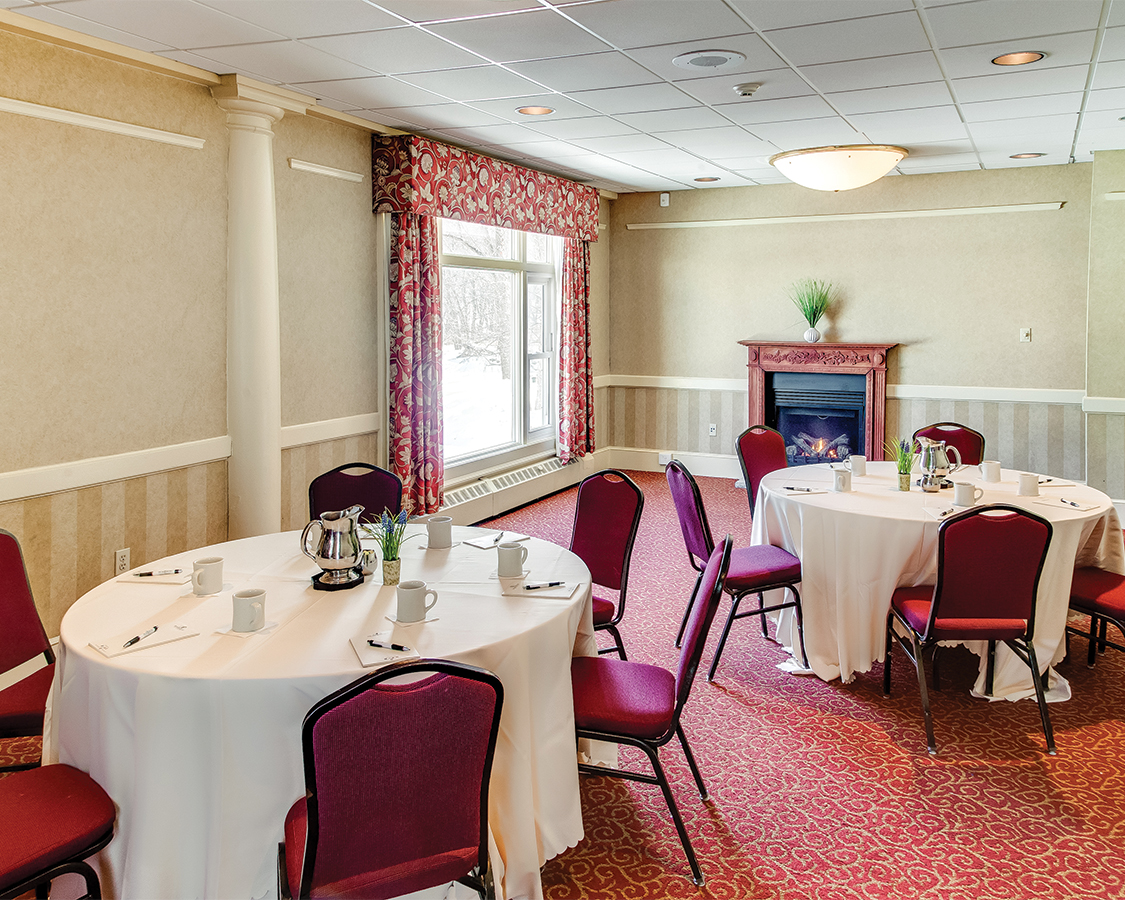 a room with tables and chairs