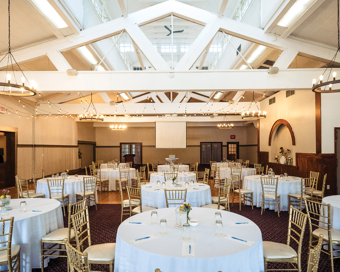 a room with tables and chairs