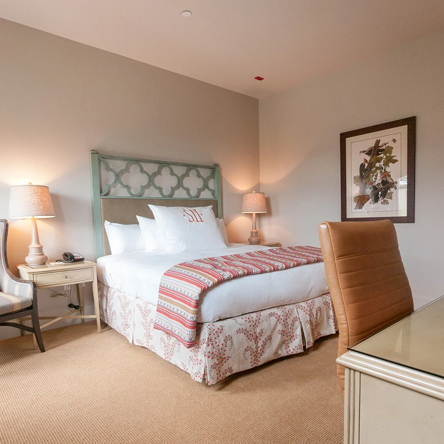 a room with a bed and chair