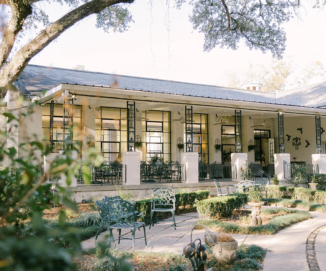 a building with a patio and chairs