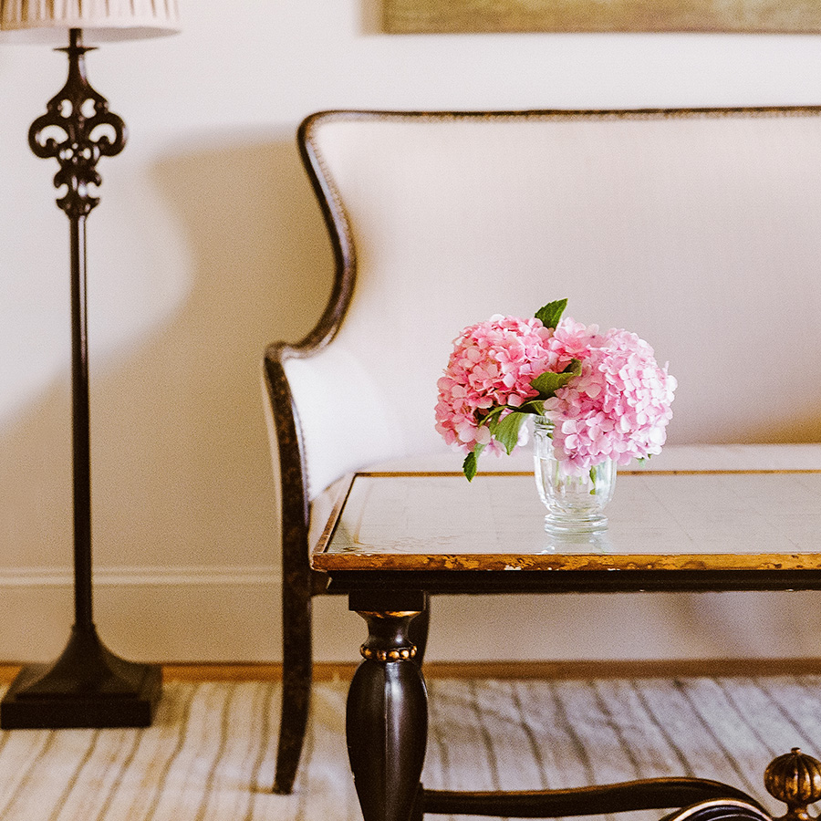 a vase of pink flowers on a table