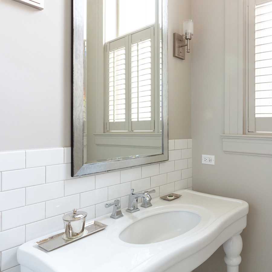 a bathroom with a mirror and sink