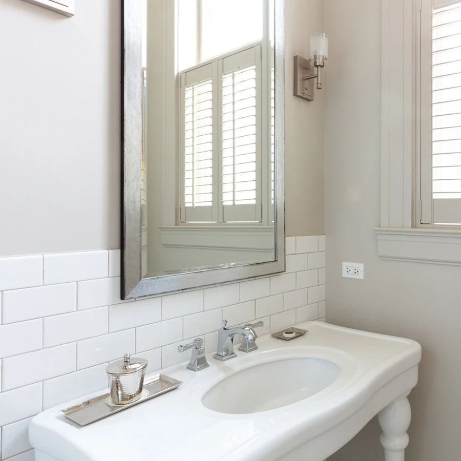 a bathroom with a mirror and sink