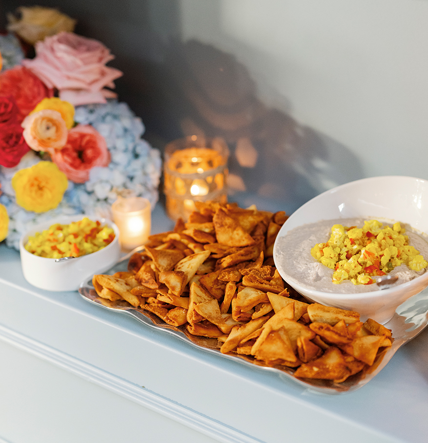 a tray of food and flowers