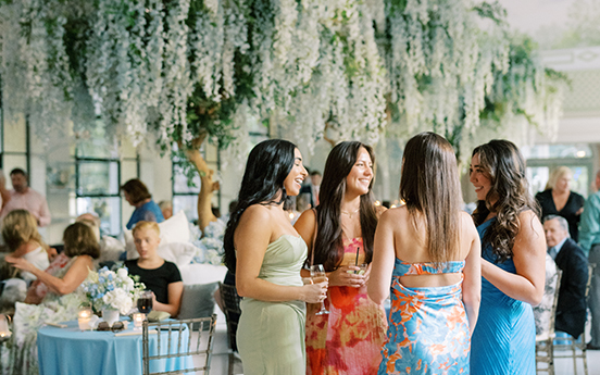 a group of women in dresses