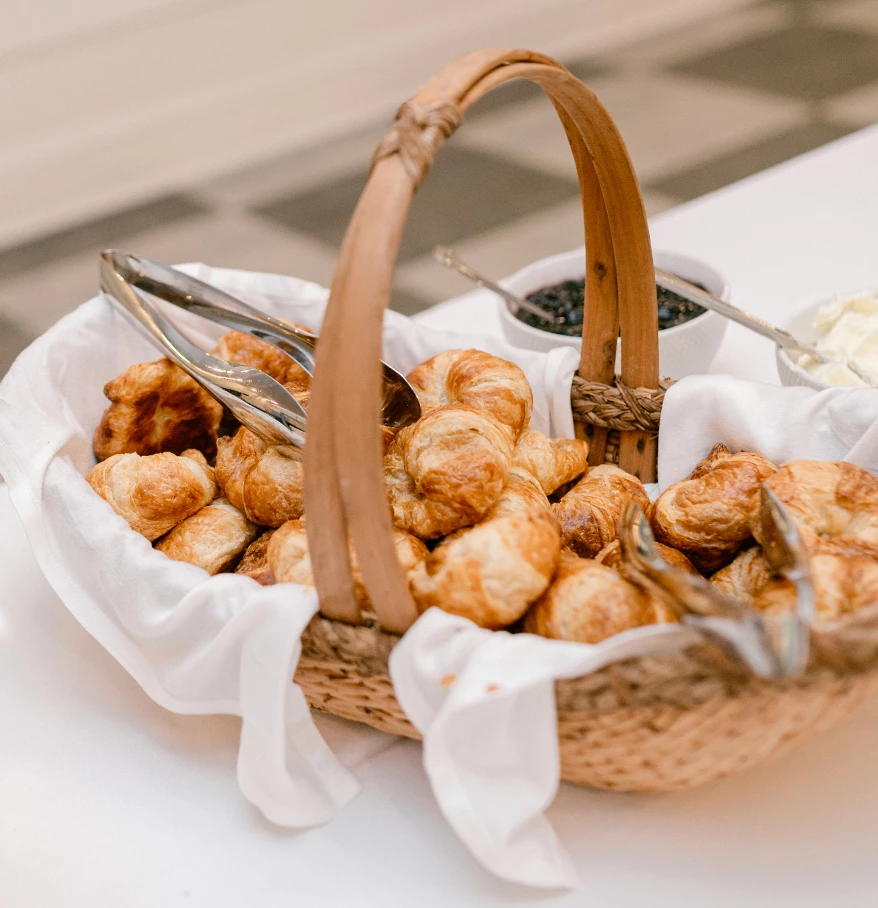 a basket of pastries and utensils