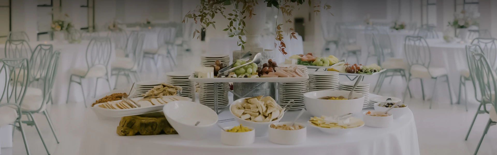 a table with plates of food and a variety of dishes