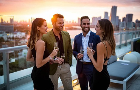 a group of people holding drinks