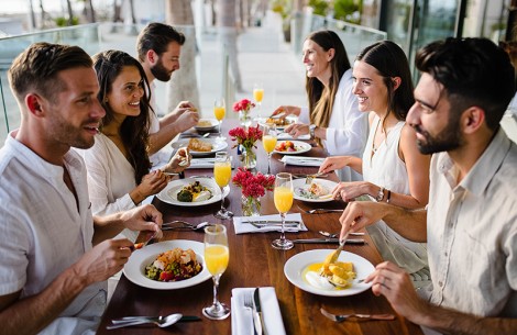 a group of people eating at a table