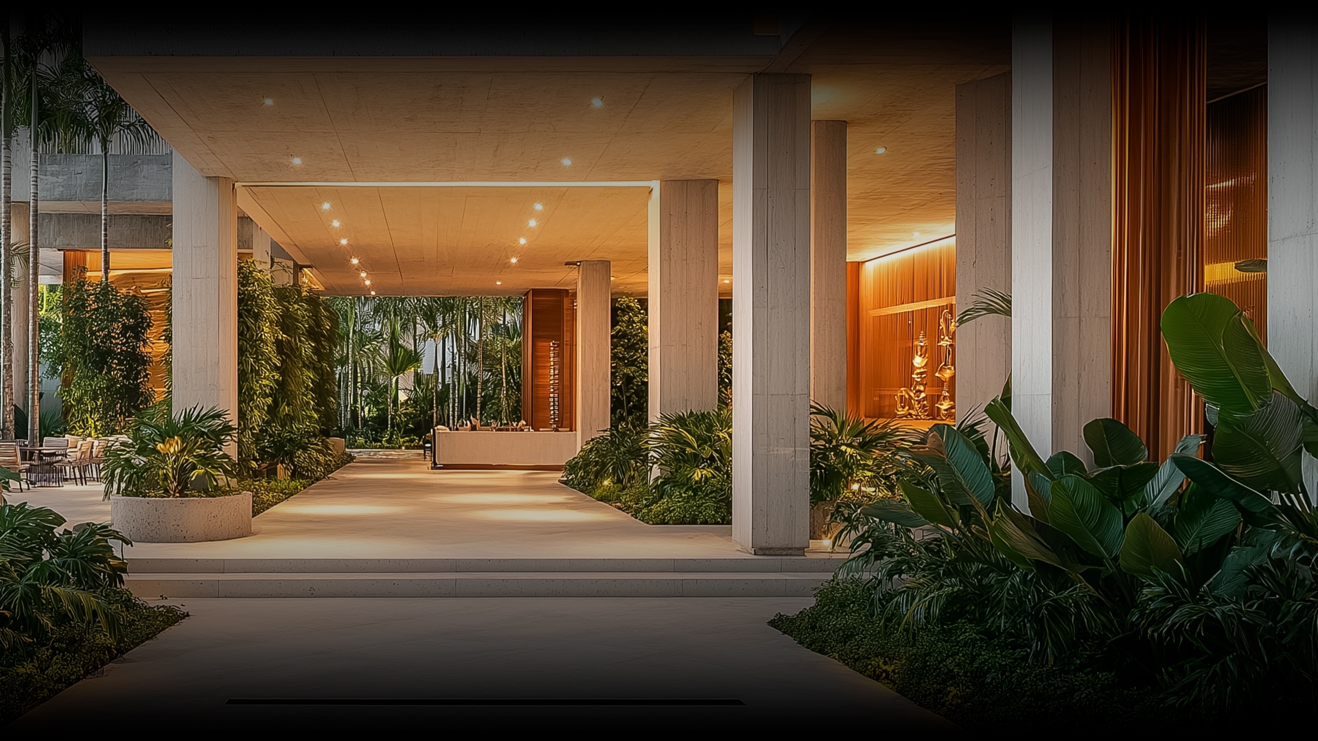 a building with columns and plants