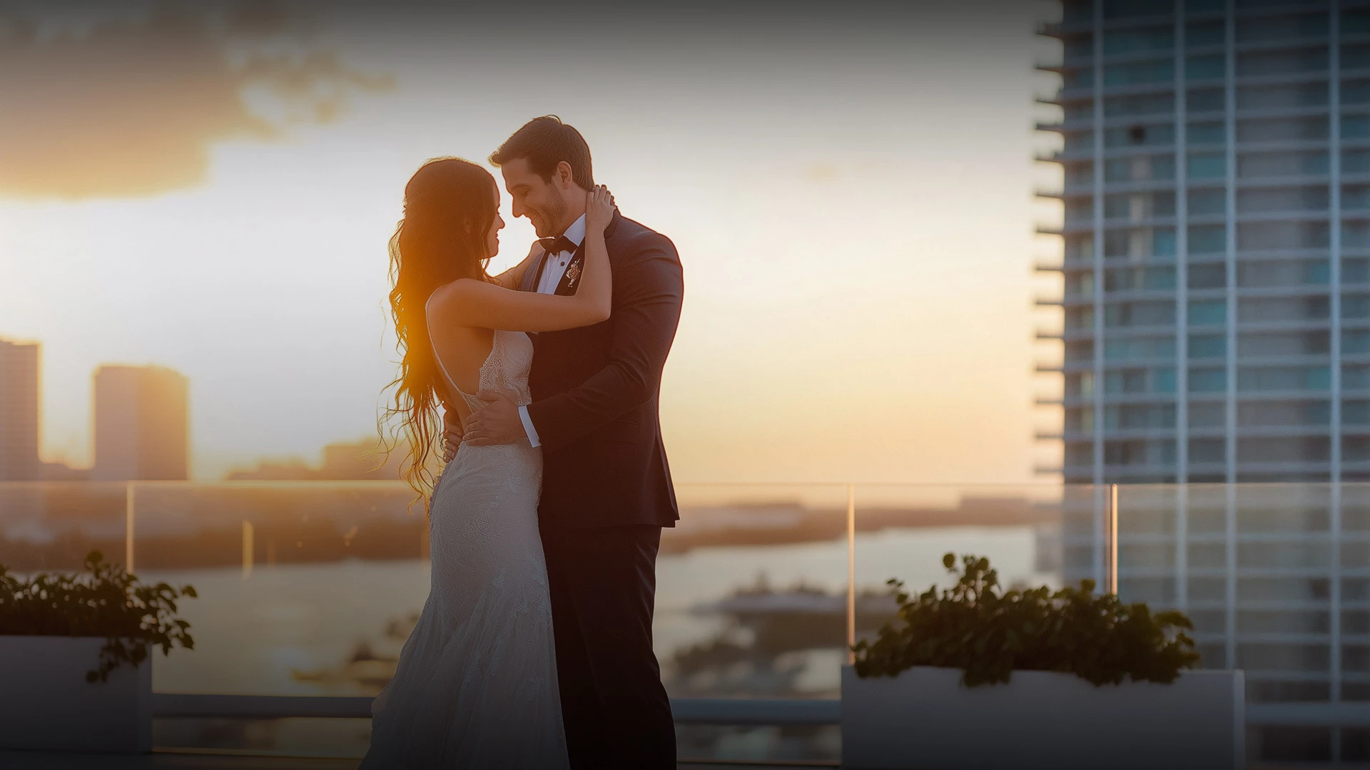 a man and woman in a wedding dress hugging