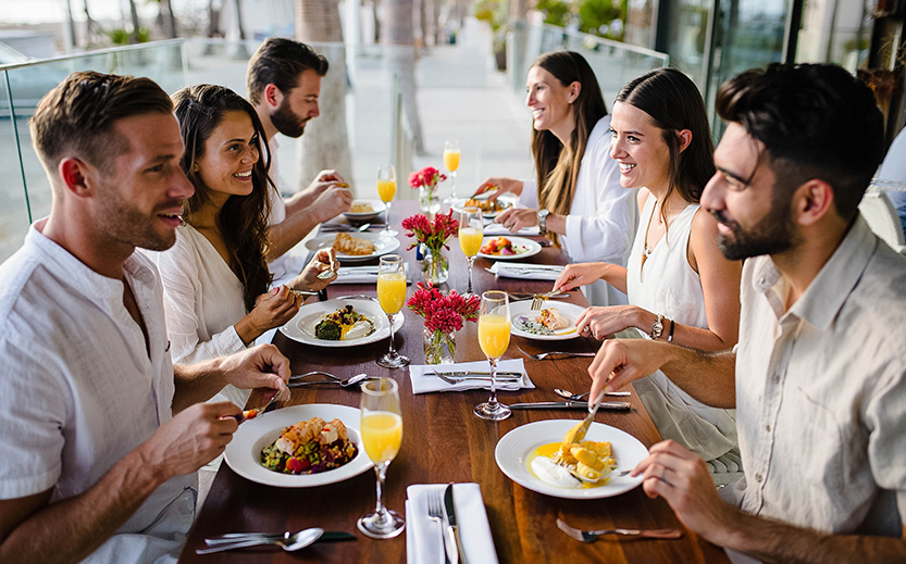 a group of people eating at a table