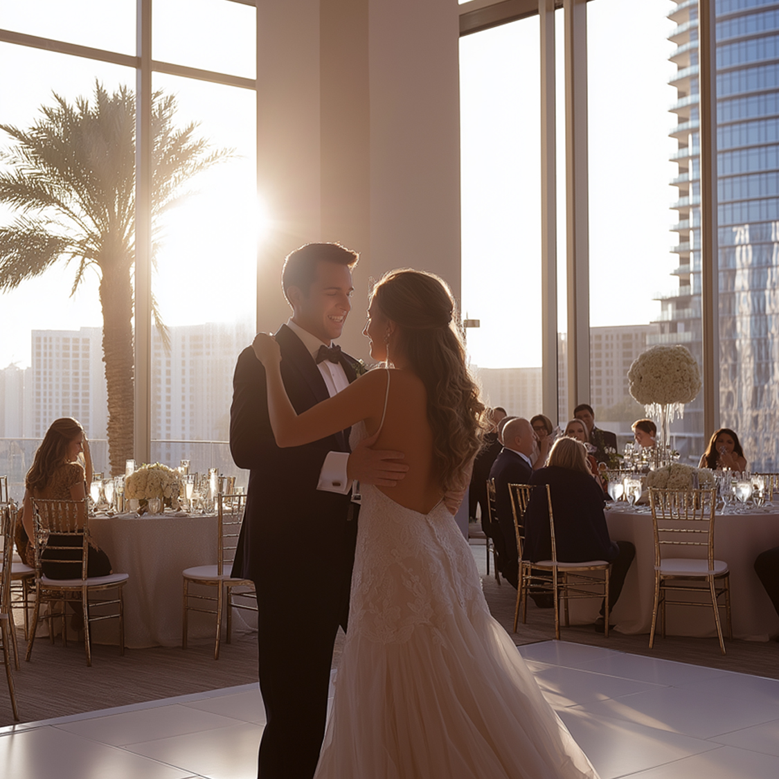 a man and woman dancing in a room with tables and chairs