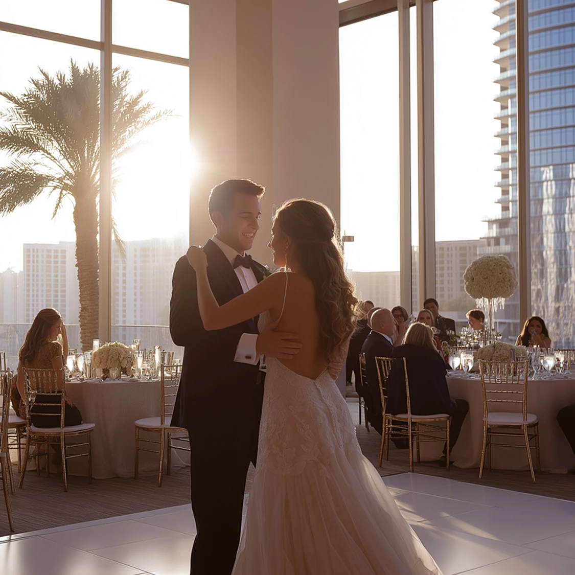 a man and woman dancing in a room with tables and chairs