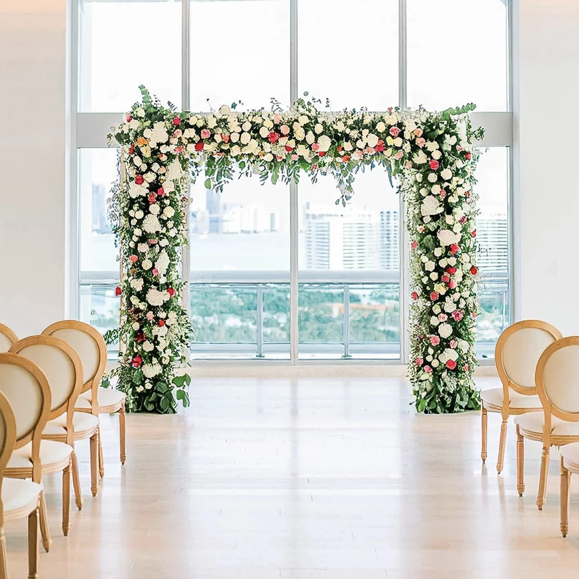a wedding ceremony with chairs and flowers