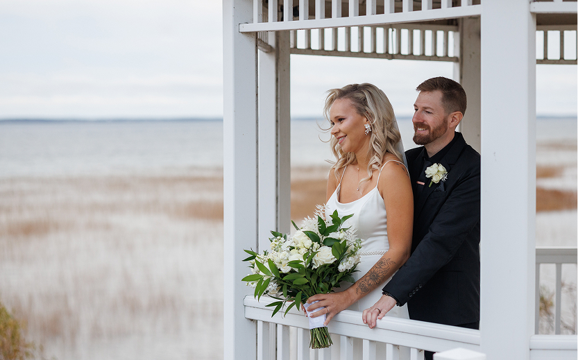 a man and woman standing in a gazebo