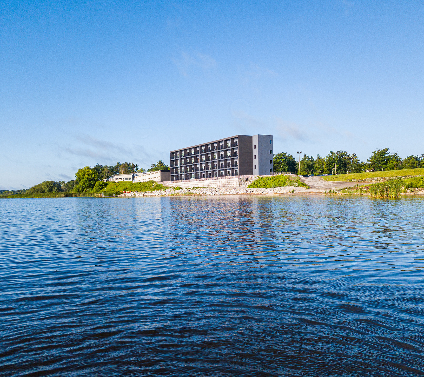 a building next to a body of water