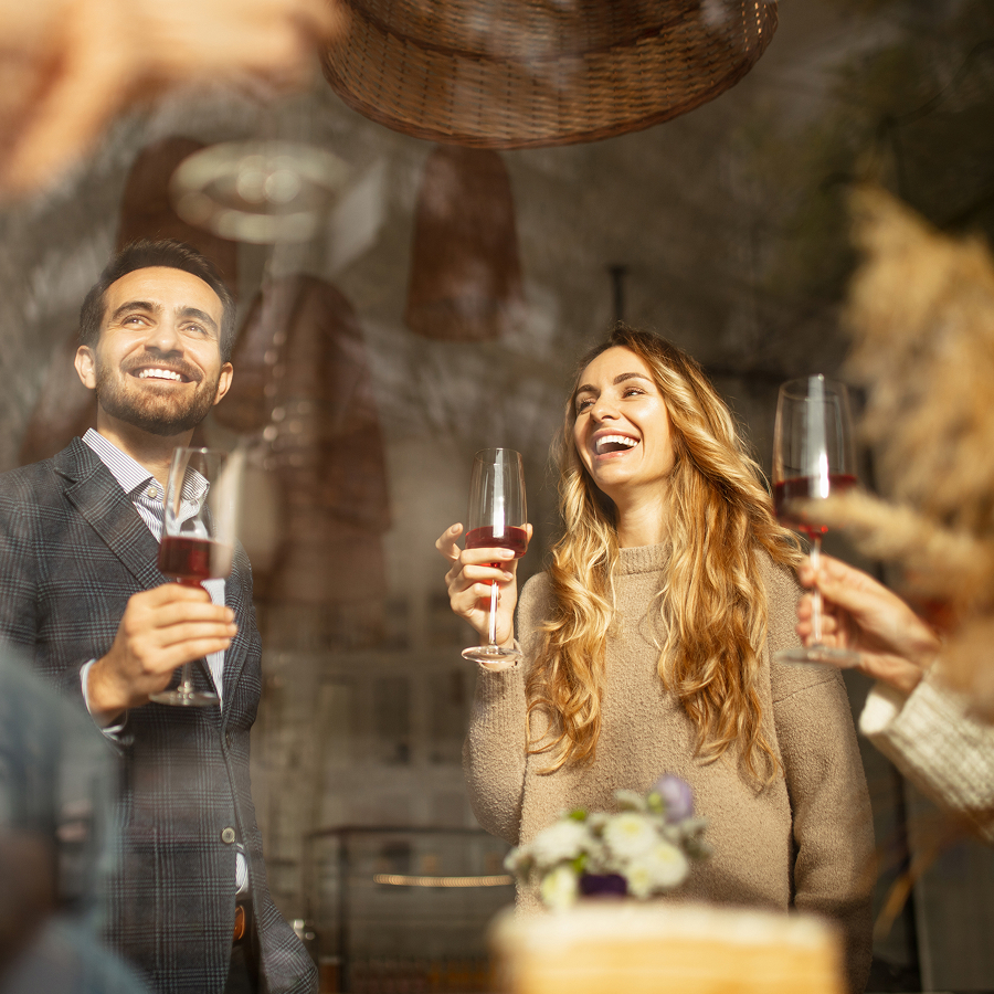a group of people holding wine glasses