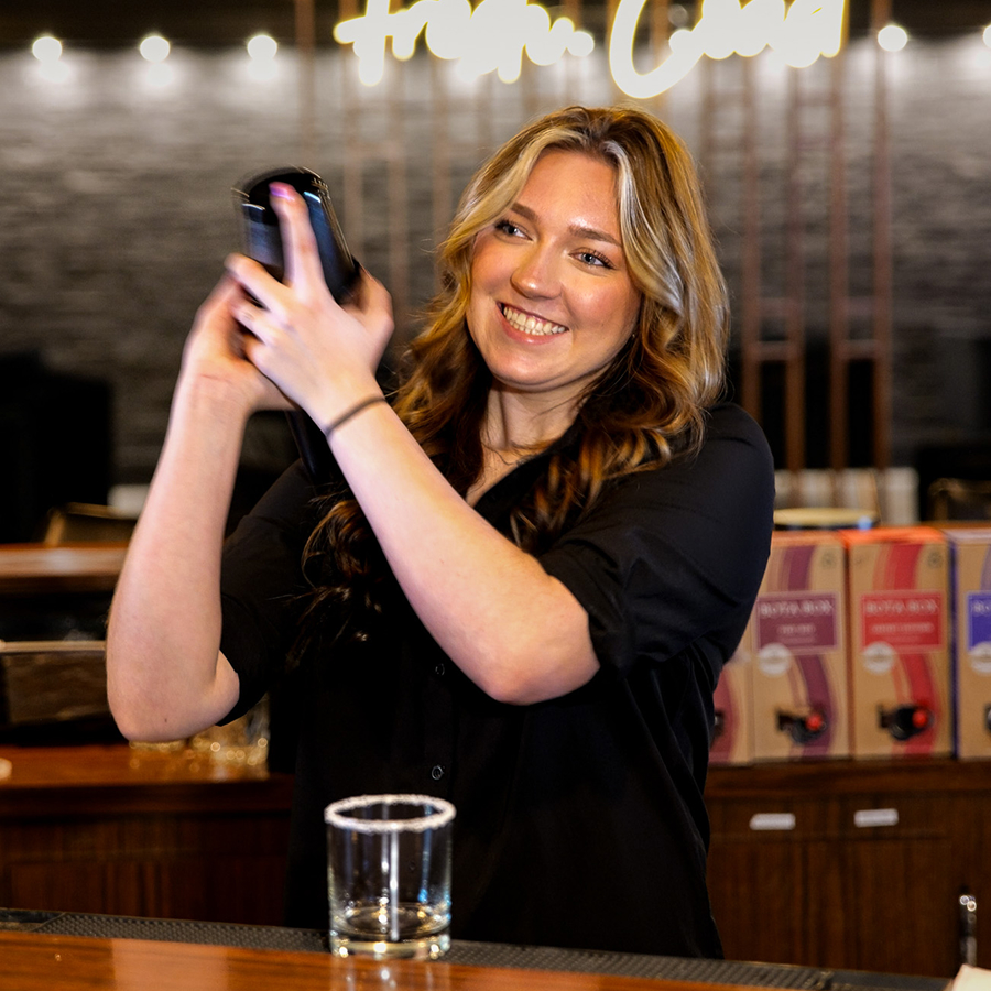 a woman holding a bar
