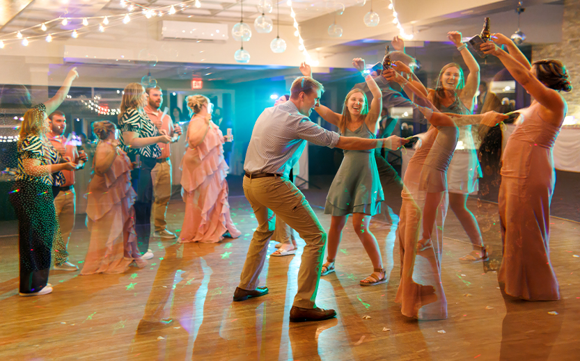 a group of people dancing in a room
