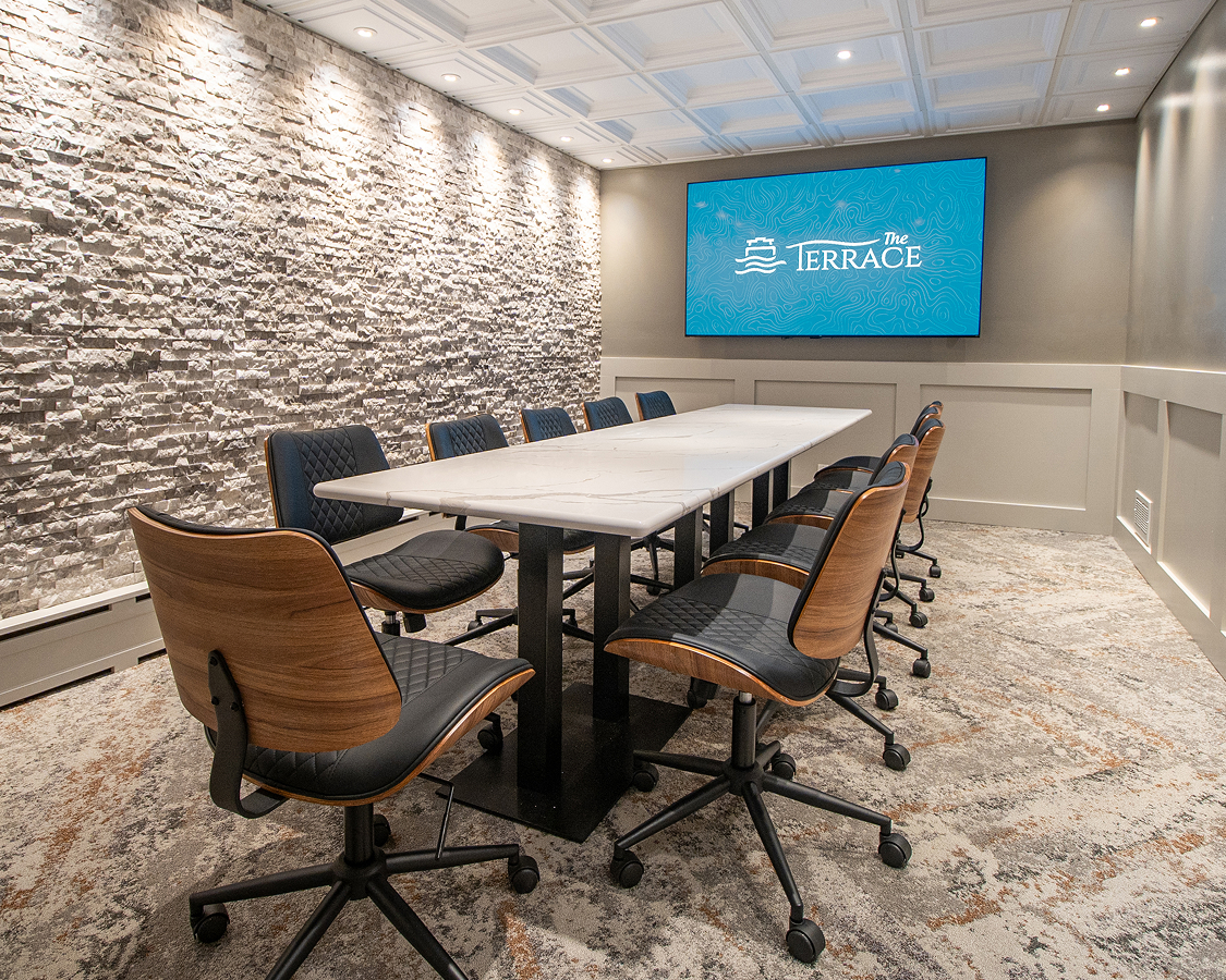 a conference room with a table and chairs