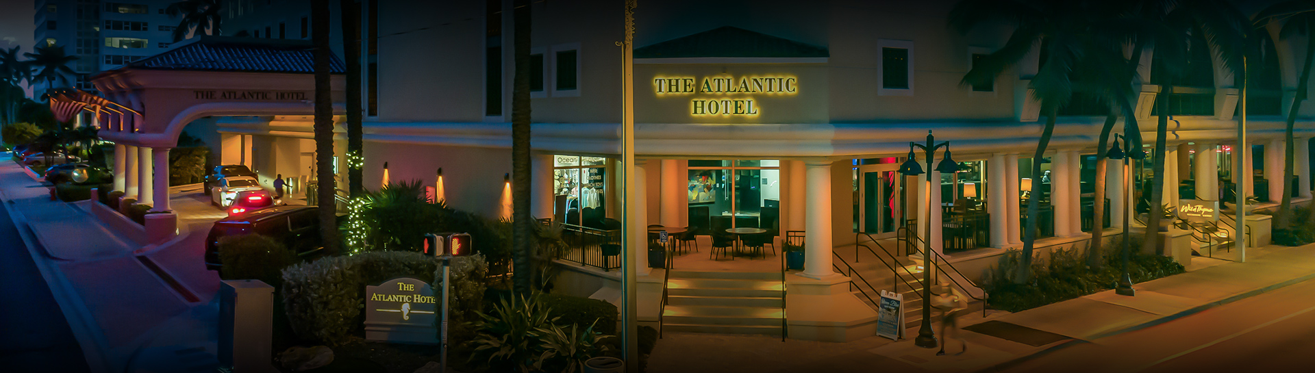 a hotel entrance with a sign