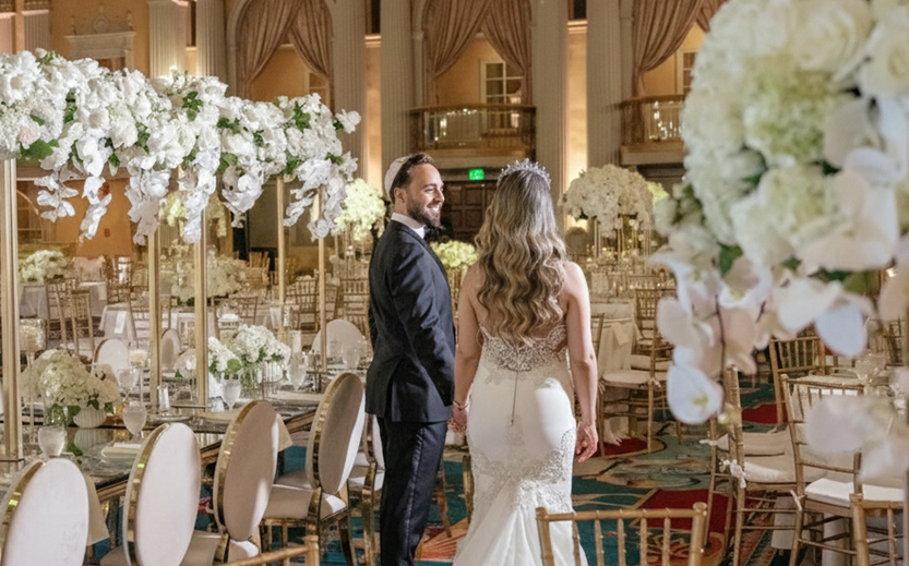 a man and woman in wedding attire