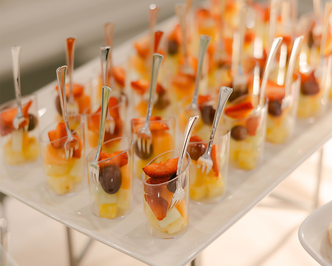 a tray of fruit cups