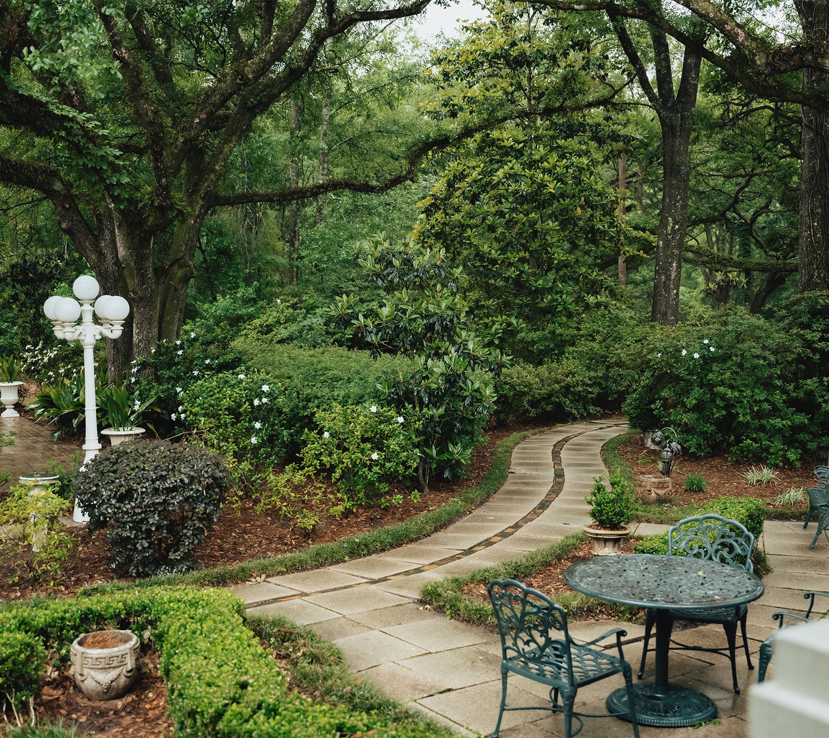 a stone path in a garden