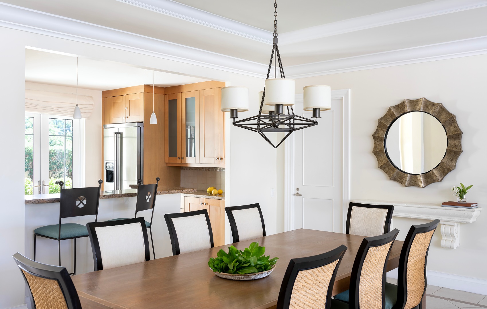 a dining room with a table and chairs
