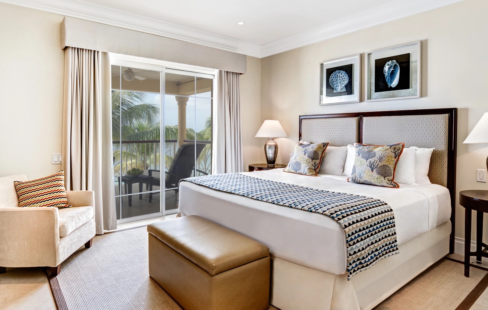 a bedroom with a bed and a glass door