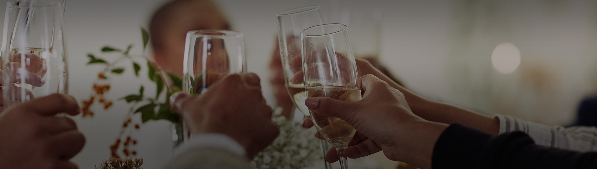 a group of people holding champagne glasses