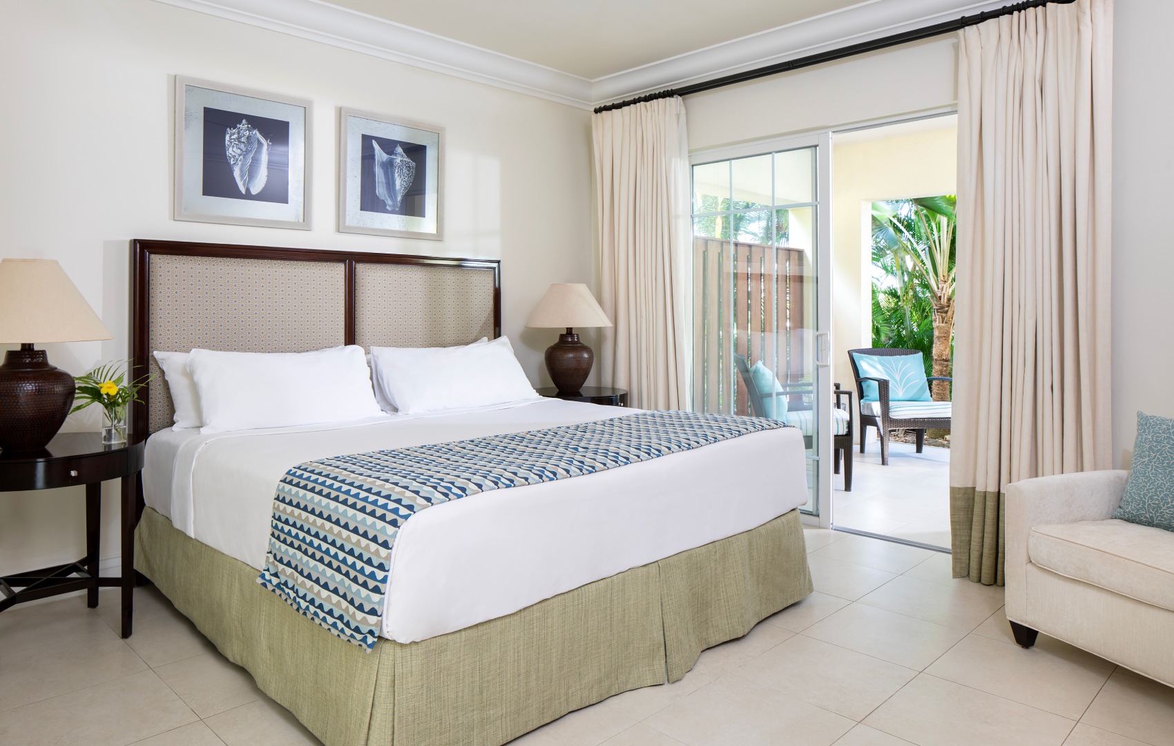 a bed in a room with a glass door