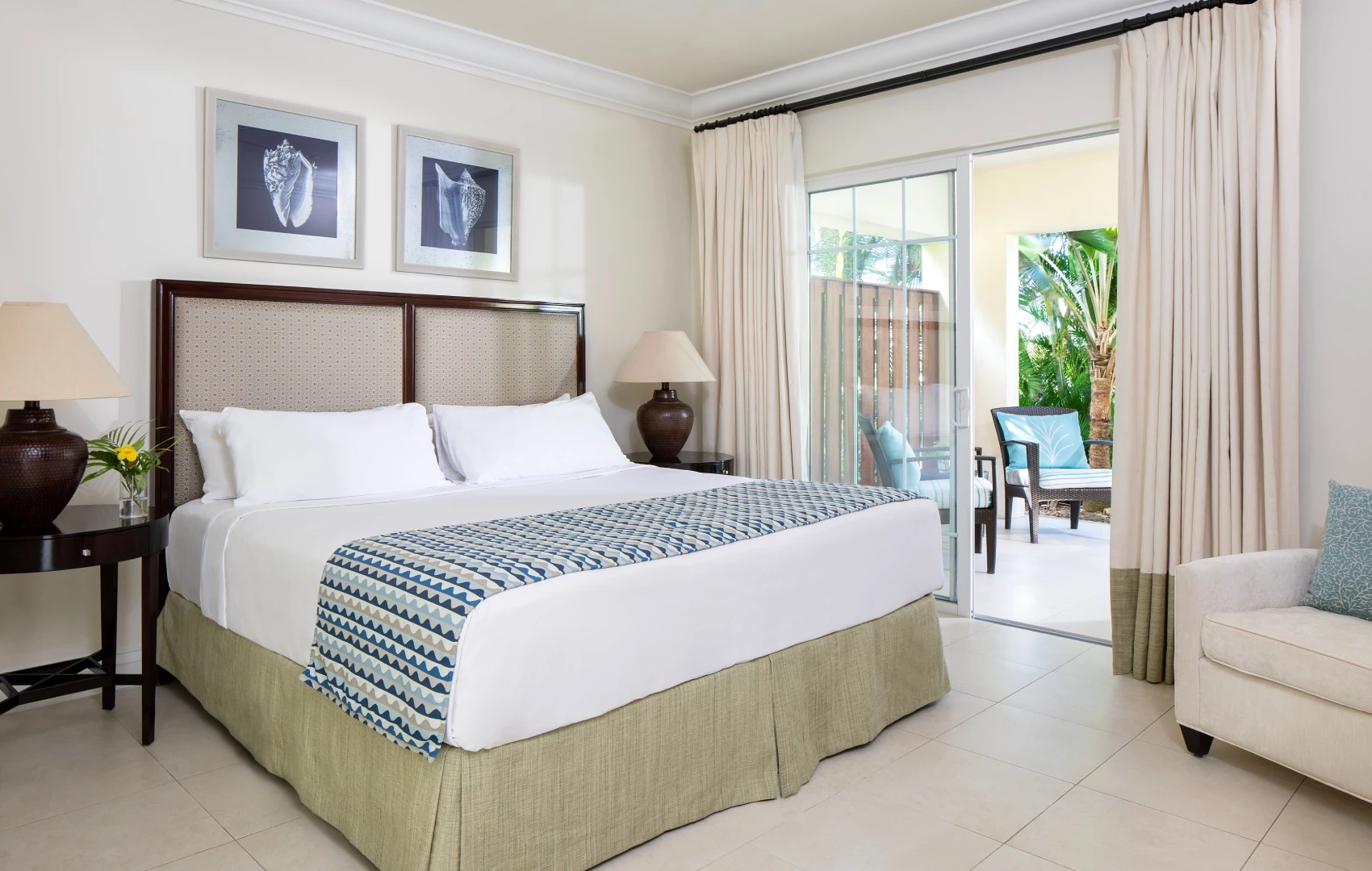 a bed in a room with a glass door