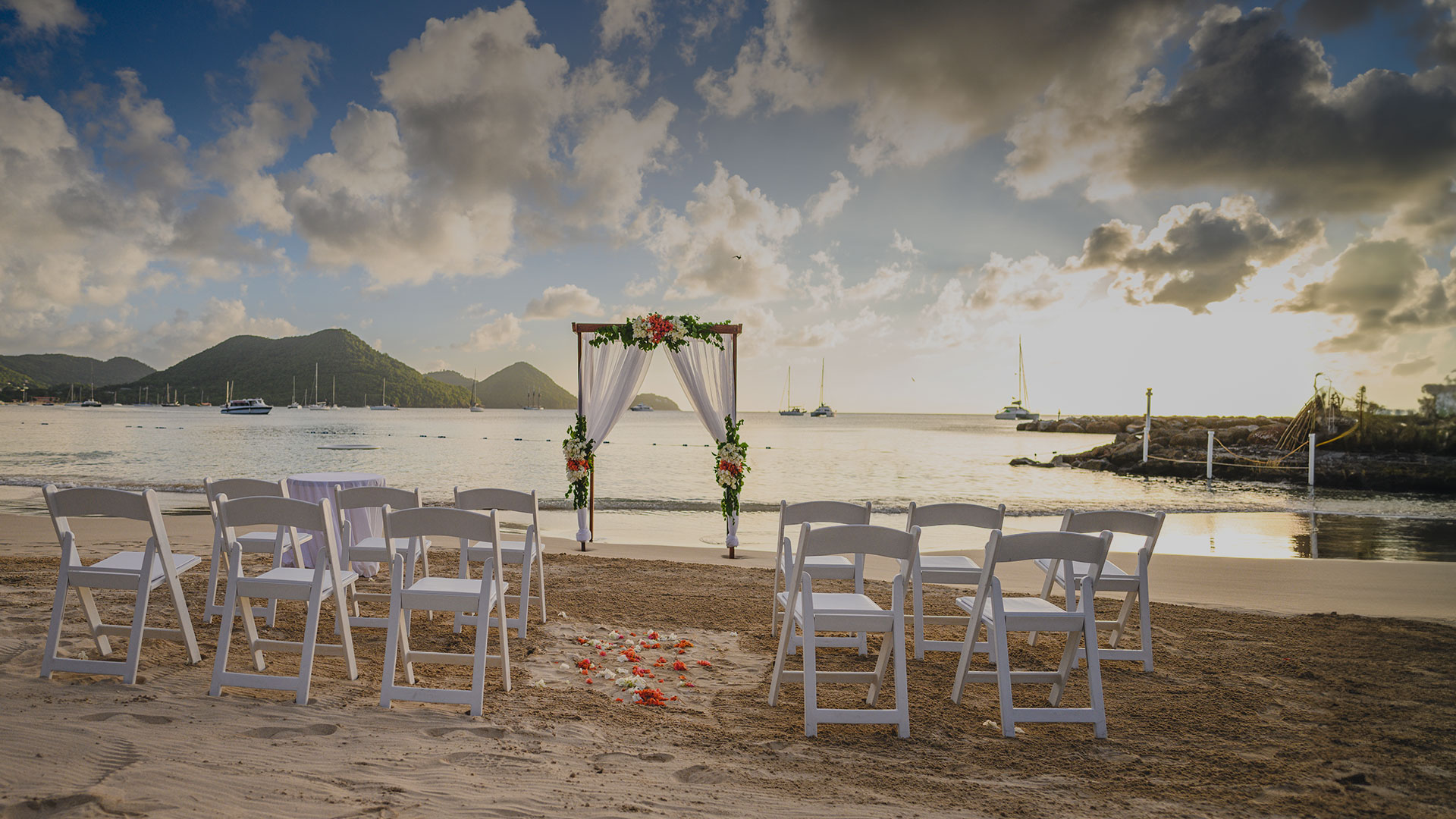 a wedding ceremony set up on a beach