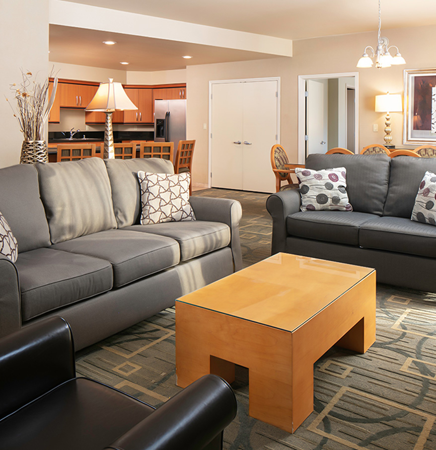 a living room with couches and a coffee table