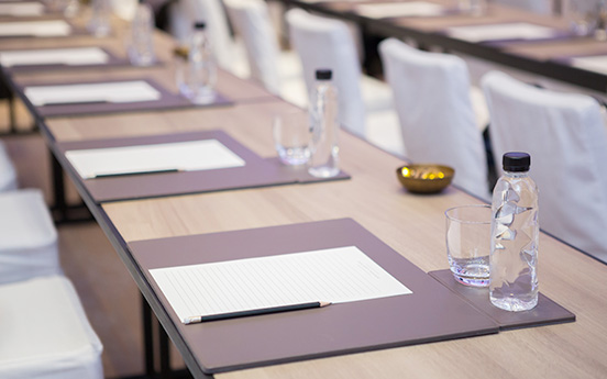 a table with papers and glasses on it