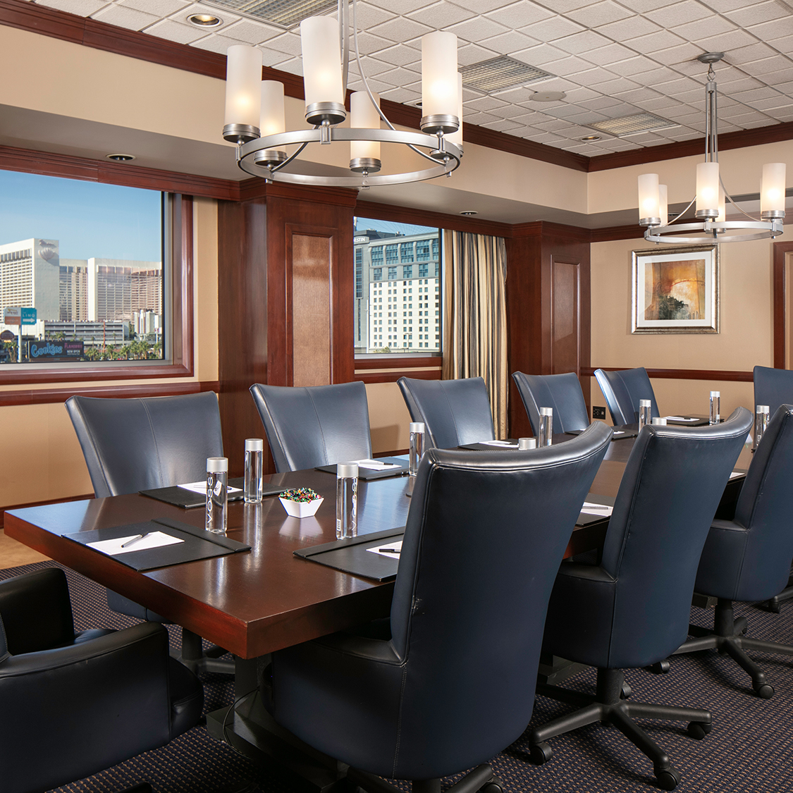 a conference room with a table and chairs