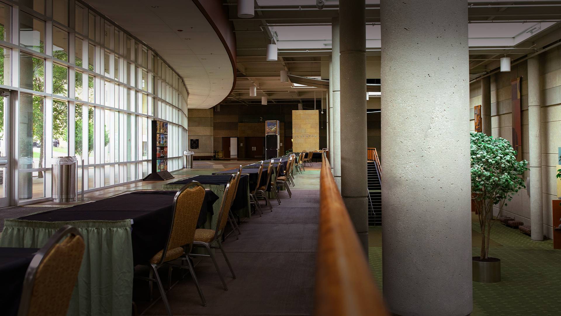 a long room with tables and chairs