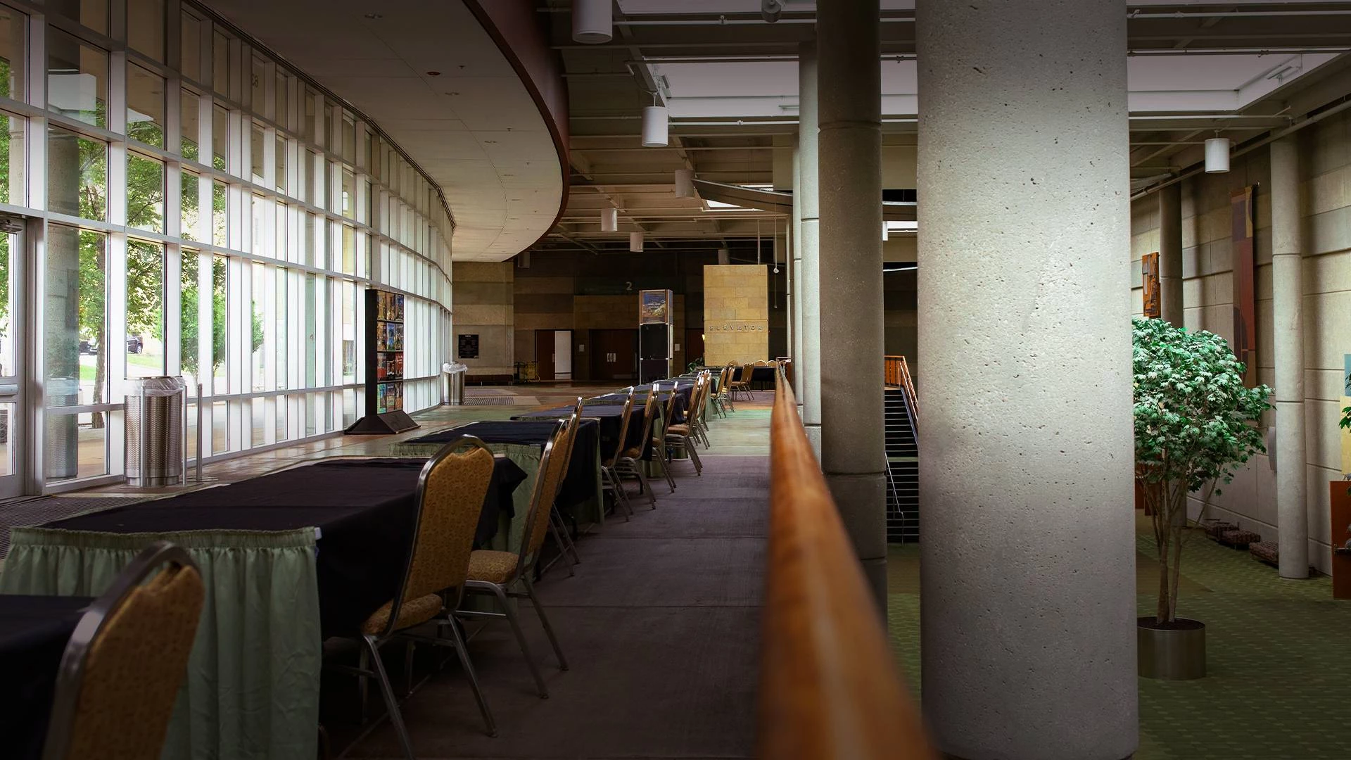 a long room with tables and chairs