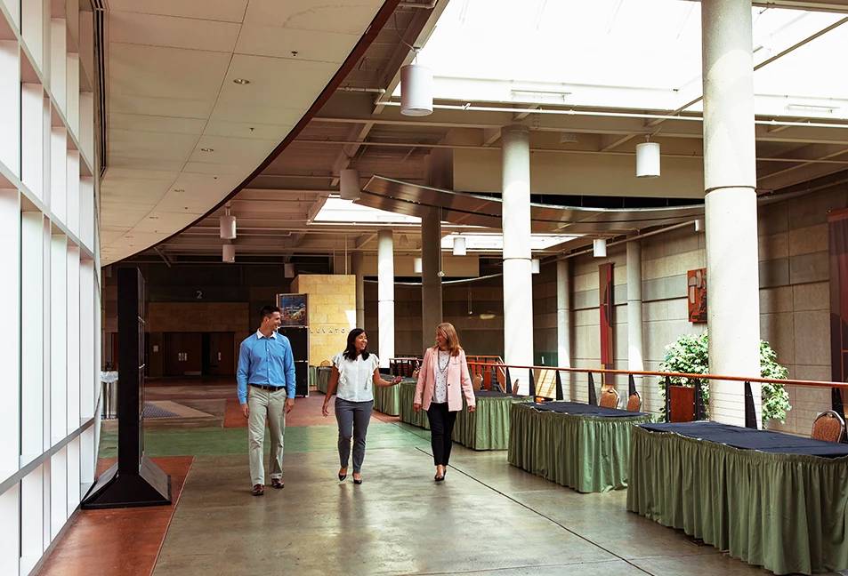 a group of people walking in a building
