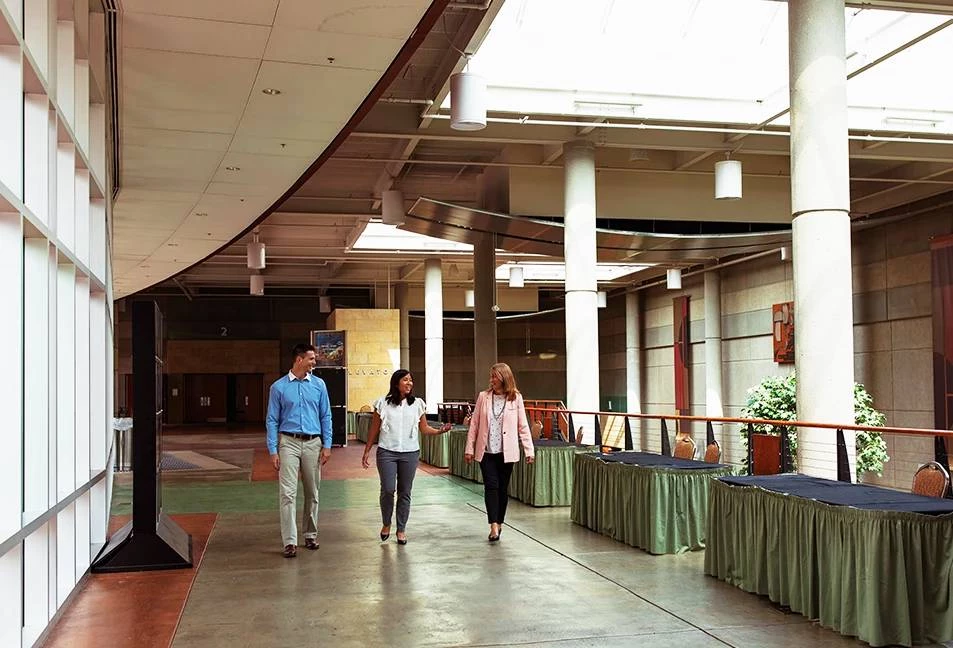 a group of people walking in a building
