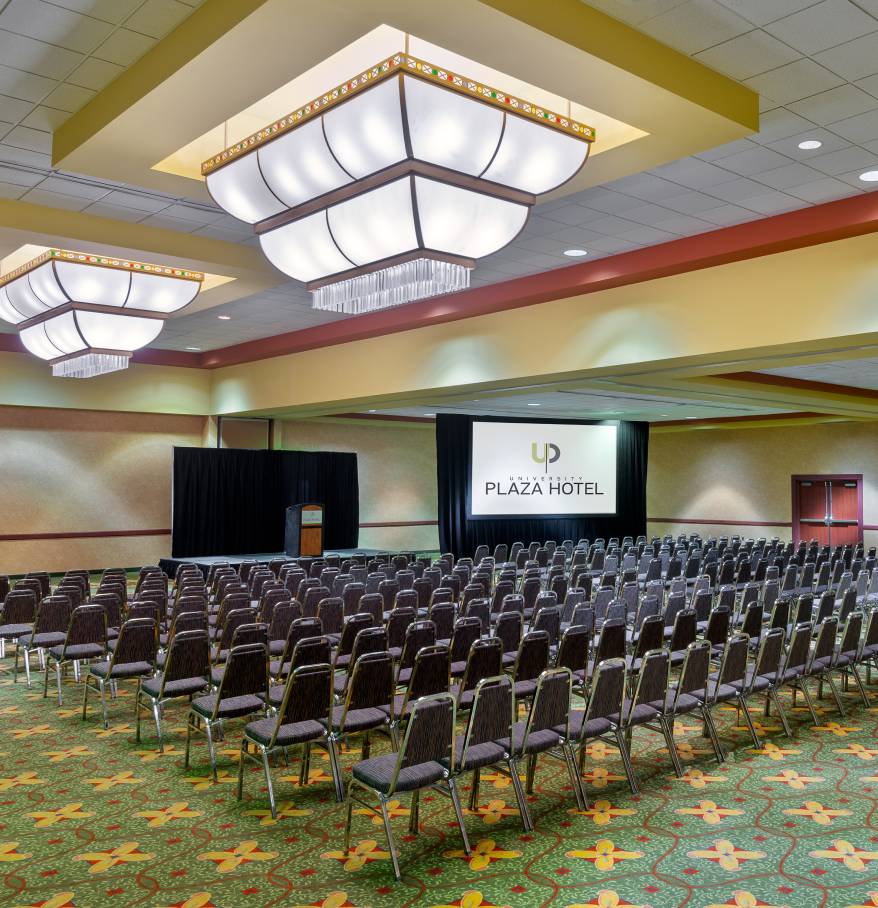 a room with many chairs and a stage